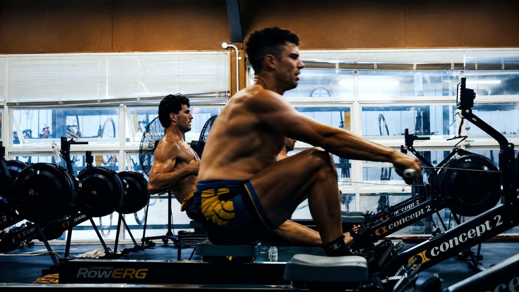Athletes training on Concept2 RowErgs in a gym